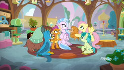 Size: 1920x1080 | Tagged: safe, screencap, fluttershy, gallus, ocellus, sandbar, silverstream, smolder, yona, changedling, changeling, classical hippogriff, dragon, earth pony, griffon, hippogriff, mouse, pony, pukwudgie, yak, g4, school daze, bird feeder, bird house, cat tree, classroom, discovery family, discovery family logo, disguise, disguised changeling, female, habitrail, logo, male, potted plant, school of friendship, sitting, stallion, student six, teenager