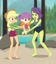 Size: 350x402 | Tagged: safe, screencap, applejack, victoria, water lily (g4), equestria girls, equestria girls series, g4, turf war, applejack's hat, baby, background human, barefoot, clothes, cowboy hat, cropped, feet, female, hat, legs, lifeguard applejack, mother, mother and child, mother and daughter, one-piece swimsuit, shorts, swimming trunks, swimsuit, toddler