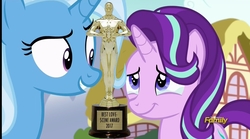 Size: 2548x1420 | Tagged: safe, edit, edited screencap, screencap, starlight glimmer, trixie, all bottled up, g4, season 7, award, cropped, crying, discovery family logo, female, get, index get, lesbian, love, oscar, ponyville, ship:startrix, shipping, tears of joy, trophy