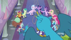 Size: 1600x900 | Tagged: safe, screencap, fluttershy, gallus, ocellus, pinkie pie, rainbow dash, rarity, sandbar, silverstream, smolder, starlight glimmer, twilight sparkle, yona, changedling, changeling, classical hippogriff, dragon, griffon, hippogriff, pony, yak, g4, school daze, bilocation, butt, corridor, dragoness, duality, eyes closed, feathered fetlocks, female, happy, high angle, holding claws, holding hooves, jewelry, male, necklace, plot, scene change, school of friendship, self paradox, student six, transition