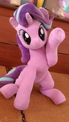 Size: 675x1200 | Tagged: safe, artist:nekokevin, starlight glimmer, pony, unicorn, series:nekokevin's glimmy, g4, cute, female, glimmerbetes, irl, looking at you, mare, photo, plushie, raised hoof, sitting, smiling, solo, sweet dreams fuel, underhoof, waving