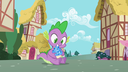 Size: 1280x720 | Tagged: safe, screencap, spike, dragon, g4, secret of my excess, cupcake, food, gem, male, ponyville, sapphire, sapphire cupcake, sitting, solo