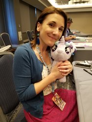 Size: 1536x2048 | Tagged: safe, starlight glimmer, human, g4, babscon, babscon 2018, female, filly, filly starlight glimmer, hug, irl, irl human, kelly sheridan, photo, pigtails, plushie, smiling, voice actor, younger
