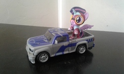Size: 2560x1536 | Tagged: safe, twilight sparkle, alicorn, pony, g4, female, irl, masked matter-horn costume, photo, power ponies, toy, transformers, truck, twilight sparkle (alicorn)