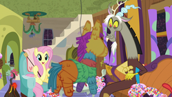 Size: 1280x720 | Tagged: safe, screencap, discord, fluttershy, pony, discordant harmony, g4, candy, food, marshmallow, piñata, smiling, sweets, tea party, volcano