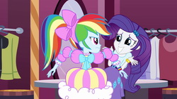 Size: 1539x866 | Tagged: safe, screencap, rainbow dash, rarity, equestria girls, g4, my little pony equestria girls, angry, bow, clothes, duo, duo female, female, hair bow, looking at each other, rainbow dash always dresses in style, rainbow dash is not amused, side ponytail, skirt, smiling, this is our big night, unamused