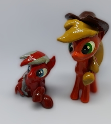 Size: 487x544 | Tagged: safe, applejack, oc, oc:steel wing, earth pony, pegasus, pony, g4, figurine, handmade, hat, lying, sculpture, simple background, standing, traditional art, white background