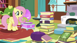 Size: 1280x720 | Tagged: safe, screencap, fluttershy, pony, fluttershy leans in, g4, book, female, fluttershy's cottage, gramophone, mare, solo