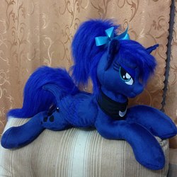 Size: 960x960 | Tagged: safe, artist:burgunzik, princess luna, alicorn, pony, g4, :t, alternate hairstyle, bedroom eyes, bow, female, hair bow, irl, looking at you, mare, missing accessory, photo, plushie, ponytail, prone, smiling, solo