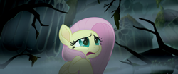 Size: 1920x804 | Tagged: safe, screencap, fluttershy, pegasus, pony, g4, my little pony: the movie, female, fog, hippogriffia, mare, mount aris, scared, solo, tree branch