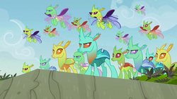 Size: 1280x720 | Tagged: safe, screencap, arista, clypeus, cornicle, frenulum (g4), lokiax, soupling, changedling, changeling, g4, to change a changeling, background changeling, big damn heroes, changeling swarm, cliff, discovery family logo, flying, grass