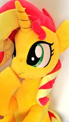 Size: 576x1024 | Tagged: safe, artist:nekokevin, sunset shimmer, pony, unicorn, g4, boop, cute, female, irl, lying down, mare, photo, plushie, raised hoof, self-boop, shimmerbetes, shimmerposting, smiling, solo, underhoof