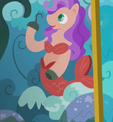 Size: 1005x1080 | Tagged: safe, screencap, mermaid, merpony, g4, grannies gone wild, amputee, backdrop, bikini, clothes, cropped, hook hand, prosthetics, rock, scenery, sight gag, stage, swimsuit, wave
