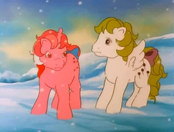 Size: 712x537 | Tagged: safe, screencap, galaxy (g1), surprise, pegasus, pony, twinkle eyed pony, unicorn, baby it's cold outside, g1, adoraprise, bow, cute, duo, female, frown, galaxy is not amused, galaxydorable, it's just snow, mare, narrowed eyes, outdoors, singing, snow, song, surprise is not amused, tail bow, unamused, we're not gonna freeze