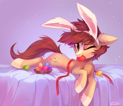 Size: 1811x1558 | Tagged: safe, artist:ramiras, artist:share dast, oc, oc only, oc:bead trail, earth pony, pony, bed, bunny ears, chest fluff, coat markings, ear fluff, easter, easter bunny, easter egg, egg, female, floppy ears, fluffy, holiday, hoof fluff, leg fluff, looking at you, mare, mouth hold, one eye closed, prone, ribbon, rule 63, socks (coat markings), solo, ych result