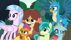Size: 1920x1080 | Tagged: safe, screencap, gallus, ocellus, sandbar, silverstream, smolder, yona, changedling, changeling, dragon, earth pony, griffon, hippogriff, pony, yak, g4, non-compete clause, female, floppy ears, frown, lidded eyes, male, ocellus is not amused, raised eyebrow, smolder is not amused, student six, unamused, yona is not amused