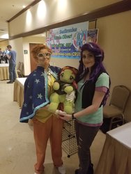 Size: 1536x2048 | Tagged: safe, starlight glimmer, sunburst, tree hugger, human, g4, clothes, cosplay, costume, everfree northwest, everfree northwest 2018, irl, irl human, photo, plushie, smiling
