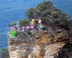 Size: 1024x826 | Tagged: safe, artist:didgereethebrony, applejack, fluttershy, rainbow dash, rarity, spike, starlight glimmer, trixie, twilight sparkle, oc, oc:didgeree, alicorn, pony, g4, australia, blue mountains, cliff, eucalyptus, hiding behind tail, irl, katoomba, lookout, mlp in australia, photo, ponies in real life, rock formation, scared, staircase, stairs, tree, twilight sparkle (alicorn), valley