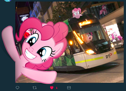 Size: 734x531 | Tagged: safe, artist:naijiwizard, edit, pinkie pie, g4, breaking the fourth wall, city, grin, happy, helmet, irl, like, looking at you, melbourne e-class tram, meta, multeity, photo, photoshop, pinkie clone, ponies in real life, raised hooves, smiling, text, this will end in parties, too much pink energy is dangerous, tram, twitter