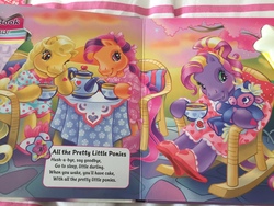 Size: 1280x960 | Tagged: safe, artist:lyn fletcher, bumbleberry, butterscotch (g3), scootaloo (g3), earth pony, pony, g3, all the pretty little horses, blushing, clothes, dreamy songs, female, food, heart, heart eyes, lullaby, mare, nightgown, plushie, rocking chair, slippers, song, tea, tea party, teabag, wingding eyes