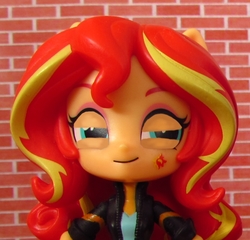 Size: 601x578 | Tagged: safe, artist:whatthehell!?, edit, sunset shimmer, equestria girls, g4, alternative cutie mark placement, clothes, doll, equestria girls minis, facial cutie mark, irl, jacket, photo, solo, squint, toy
