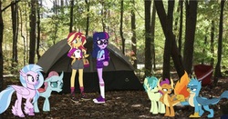 Size: 1761x921 | Tagged: safe, editor:php77, gallus, ocellus, sandbar, sci-twi, silverstream, smolder, sunset shimmer, twilight sparkle, classical hippogriff, griffon, hippogriff, pony, equestria girls, g4, backpack, bag, belt, boots, camp everfree outfits, campfire, camping trip, converse, equestria girls in real life, family, forest, glasses, irl, photo, ponies in real life, ponytail, shoes, sun, tent, wallpaper
