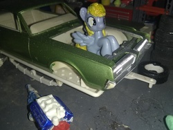 Size: 3264x2448 | Tagged: safe, derpy hooves, pony, g4, blind bag, car, engine, everfree customs, garage, high res, irl, mechanic, mercury (car), mercury cougar, photo, solo, tires, toolbox, toy, trailer, v8