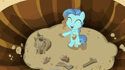 Size: 1280x720 | Tagged: safe, screencap, petunia paleo, dinosaur, earth pony, pony, g4, the fault in our cutie marks, bone, dead, dirt, eyes closed, female, filly, happy, hole, pointing, ponysaur, skeleton, skull, smiling, solo, spiny back ponysaurus