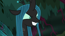 Size: 1280x720 | Tagged: safe, screencap, queen chrysalis, changeling, changeling queen, g4, the mean 6, everfree forest, evil smile, fangs, female, forest, former queen chrysalis, grin, plotting, smiling, solo