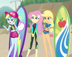 Size: 910x720 | Tagged: safe, screencap, applejack, fluttershy, rainbow dash, blue crushed, equestria girls, equestria girls series, g4, clothes, female, fluttershy's wetsuit, surfboard, swimsuit, wetsuit
