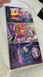 Size: 721x1281 | Tagged: safe, apple bloom, lilymoon, princess luna, scootaloo, smartyhoof, starlight glimmer, sweetie belle, alicorn, earth pony, pegasus, pony, unicorn, cursed crusaders, g4, journey to the livewood, my little pony: ponyville mysteries, peryton panic, book, cutie mark crusaders, female, filly, irl, merchandise, photo