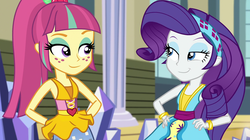 Size: 1912x1072 | Tagged: safe, screencap, rarity, sour sweet, equestria girls, equestria girls specials, g4, my little pony equestria girls: dance magic, :j, canterlot high, clothes, dress, duo, female, freckles, hand on hip, headband, lidded eyes, ponytail, skirt, smiling, teletoon