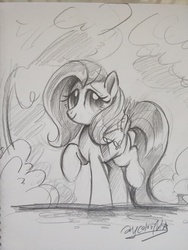 Size: 3456x4608 | Tagged: safe, artist:oofycolorful, fluttershy, pegasus, pony, g4, cute, female, grayscale, looking at you, mare, monochrome, outdoors, pencil drawing, raised hoof, raised leg, saddle bag, shyabetes, simple background, sketch, smiling, solo, three quarter view, traditional art