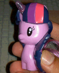Size: 250x311 | Tagged: safe, twilight sparkle, alicorn, pony, g4, animated, cutie mark crew, female, gif, glowing horn, horn, irl, mcdonald's, merchandise, photo, toy, twilight sparkle (alicorn), wat