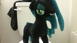 Size: 2048x1152 | Tagged: safe, queen chrysalis, changeling, g4, bathroom, irl, looking at you, photo, plushie, smiling, solo, toilet, wingless