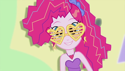 Size: 1280x720 | Tagged: safe, screencap, pinkie pie, equestria girls, friendship through the ages, g4, bare shoulders, female, glasses, heart, heart necklace, heart shaped glasses, jewelry, necklace, new wave pinkie, shutter shades, sleeveless, solo, strapless, sunglasses