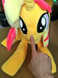 Size: 767x1024 | Tagged: safe, artist:nekokevin, sunset shimmer, human, pony, unicorn, g4, boop, cute, disembodied hand, female, hand, irl, irl human, looking at you, lying down, mare, photo, plushie, shimmerbetes, smiling, solo