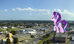Size: 1000x591 | Tagged: safe, artist:jerryakira79, starlight glimmer, pony, unicorn, g4, car, female, giant ponies in real life, giant pony, giant starlight glimmer, irl, macro, mare, photo, ponies in real life, tree