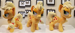 Size: 1024x451 | Tagged: safe, artist:plushypuppy, applejack, earth pony, pony, g4, female, irl, lidded eyes, mare, missing accessory, photo, plushie, solo, standing