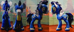 Size: 1280x562 | Tagged: safe, artist:plushypuppy, soarin', pegasus, pony, g4, clothes, irl, male, photo, plushie, shiny, solo, spread wings, stallion, standing, uniform, wings, wonderbolts uniform