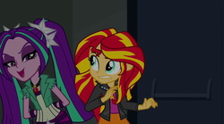 Size: 1280x714 | Tagged: safe, screencap, aria blaze, sunset shimmer, equestria girls, g4, my little pony equestria girls: rainbow rocks, canterlot high, clothes, gem, jacket, leather jacket, pigtails, siren gem, twintails, vest