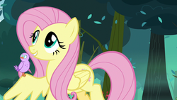 Size: 1280x720 | Tagged: safe, screencap, fluttershy, bird, pegasus, pony, g4, season 8, the mean 6, chick, cute, female, forest, mare, shyabetes, smiling, spread wings