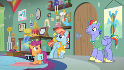 Size: 1280x720 | Tagged: safe, screencap, scootaloo, windy whistles, pegasus, pony, g4, parental glideance, book, camera, clothes, crown, diaper, female, jewelry, male, mare, medal, plushie, poster, regalia, stallion, trophy