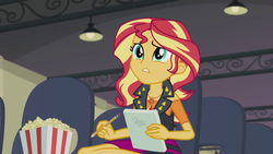 Size: 1280x720 | Tagged: safe, screencap, sunset shimmer, equestria girls, g4, my little pony equestria girls: better together, stressed in show, female, food, geode of empathy, pencil, popcorn, solo