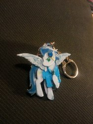 Size: 810x1080 | Tagged: safe, artist:king-franchesco, soarin', pegasus, pony, g4, clothes, cutie mark, goggles, hooves, irl, keychain, male, photo, raised hoof, solo, spread wings, stallion, uniform, wings, wonderbolts, wonderbolts uniform