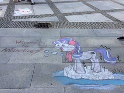 Size: 1200x900 | Tagged: safe, photographer:squeakybelle, starlight glimmer, pony, galacon, g4, antarctica, chalk, chalk drawing, clothes, cold, earmuffs, equal cutie mark, equalized, female, freezing, ice, scarf, shivering, smiling, solo, traditional art, water