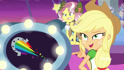 Size: 1280x720 | Tagged: safe, screencap, applejack, sunset shimmer, vignette valencia, equestria girls, equestria girls specials, g4, my little pony equestria girls: better together, my little pony equestria girls: rollercoaster of friendship, discovery family logo, smiling, smirk, stage