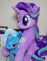 Size: 929x1200 | Tagged: safe, artist:nekokevin, starlight glimmer, trixie, pony, unicorn, series:nekokevin's glimmy, g4, 4de, duo, female, irl, mare, narrowed eyes, photo, plushie, sitting, size difference, smiling, table