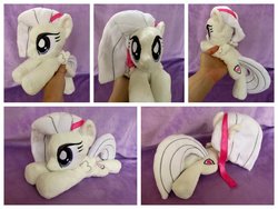 Size: 1024x768 | Tagged: safe, artist:equinepalette, oc, oc only, oc:mangolia mane, pegasus, pony, beanie (plushie), female, hand, irl, mare, photo, plushie, prone, ribbon, solo