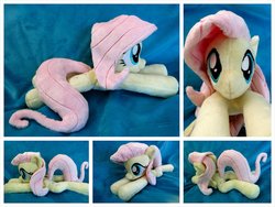Size: 1600x1200 | Tagged: safe, artist:equinepalette, fluttershy, pegasus, pony, g4, beanie (plushie), female, hand, irl, mare, photo, plushie, prone, solo